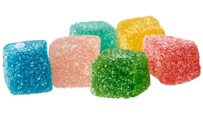 Close up view of 6 THC Gummies available at Simple Garden CBD in Texas.