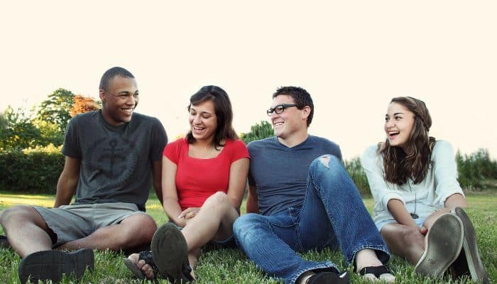 Two young men and two young women enjoying the use of Chandler THC edibles bought from Simple Garden CBD.