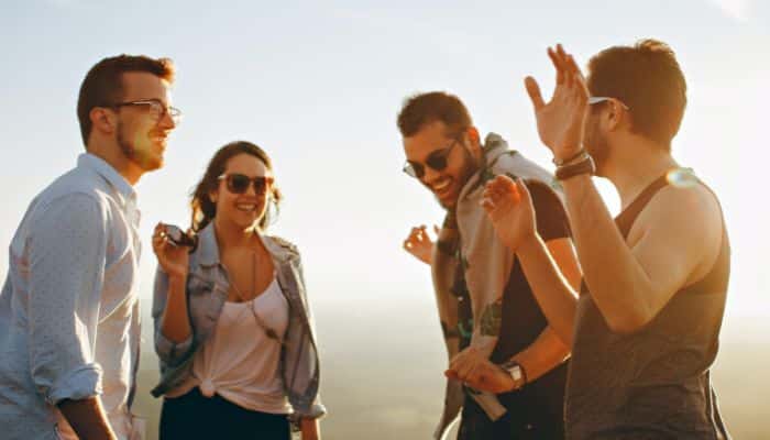 Two young men and two young women enjoying the use of Surprise THC edibles bought from Simple Garden CBD.