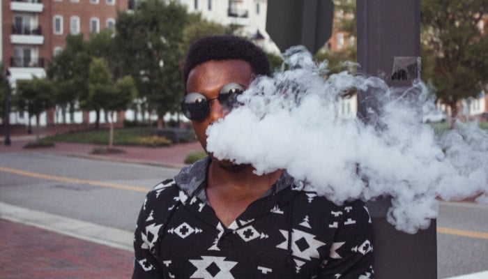 Man using Fort Lauderdale FL Delta 8 THCP Vape Cartridge bought from Simple Garden.