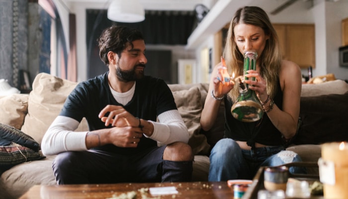 Man and woman smoking THCa flower near Chula Vista, California.